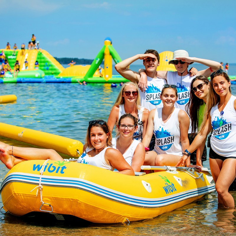 a group of people on a raft in a body of water